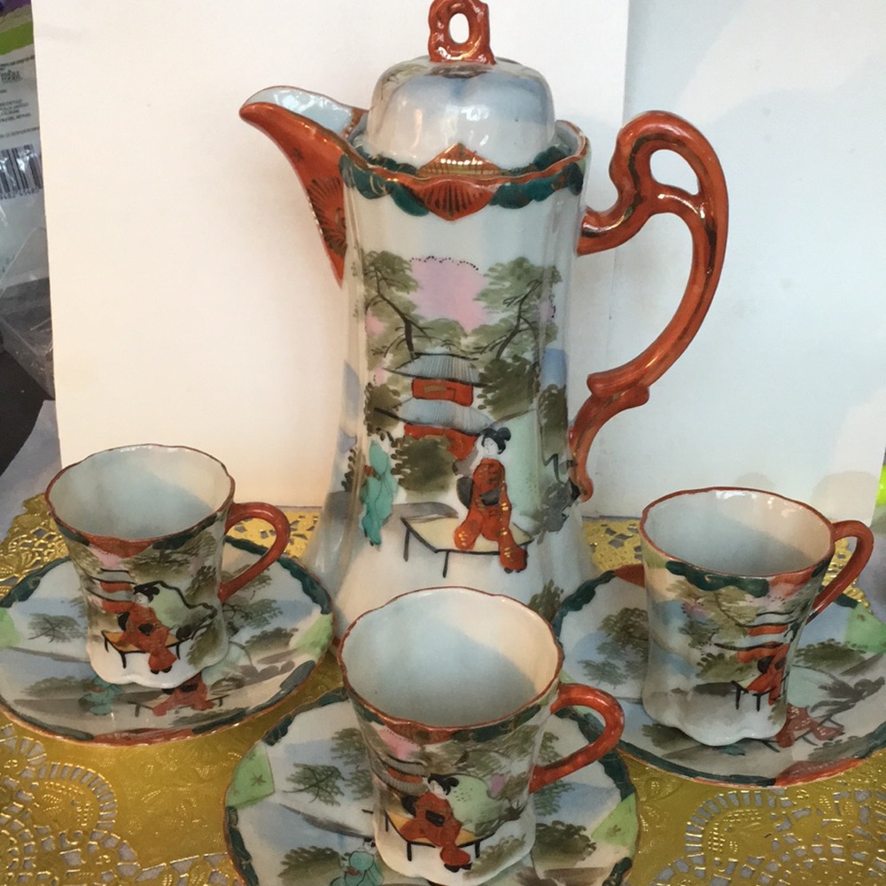 Japanese Pitcher with three cup and saucer sets